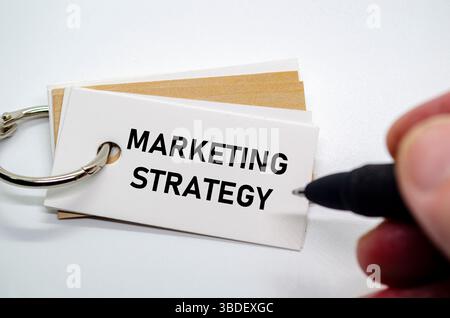Strategic marketing plan text shown on white notepad for brand growth and audience reach Stock Photo