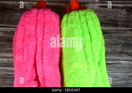 microfiber towel mop, a microfiber towel is super absorbent for superior spill and dirt pick-up, providing a thorough cleaning on all floor surfaces i Stock Photo