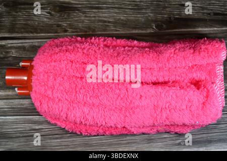 microfiber towel mop, a microfiber towel is super absorbent for superior spill and dirt pick-up, providing a thorough cleaning on all floor surfaces i Stock Photo