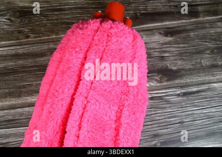 microfiber towel mop, a microfiber towel is super absorbent for superior spill and dirt pick-up, providing a thorough cleaning on all floor surfaces i Stock Photo