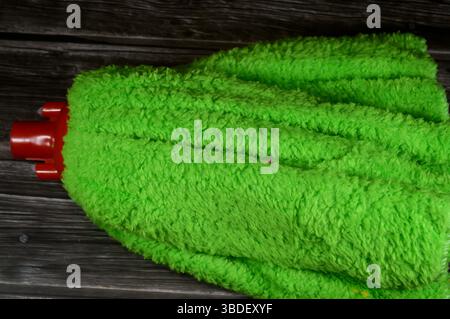 microfiber towel mop, a microfiber towel is super absorbent for superior spill and dirt pick-up, providing a thorough cleaning on all floor surfaces i Stock Photo