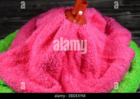 microfiber towel mop, a microfiber towel is super absorbent for superior spill and dirt pick-up, providing a thorough cleaning on all floor surfaces i Stock Photo