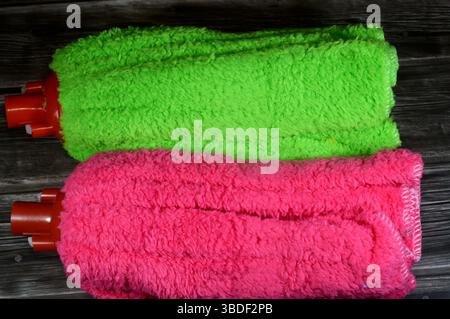 microfiber towel mop, a microfiber towel is super absorbent for superior spill and dirt pick-up, providing a thorough cleaning on all floor surfaces i Stock Photo