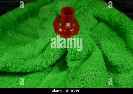 microfiber towel mop, a microfiber towel is super absorbent for superior spill and dirt pick-up, providing a thorough cleaning on all floor surfaces i Stock Photo