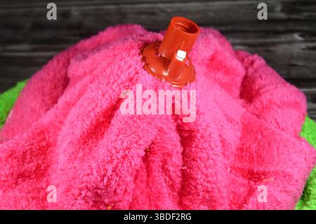 microfiber towel mop, a microfiber towel is super absorbent for superior spill and dirt pick-up, providing a thorough cleaning on all floor surfaces i Stock Photo