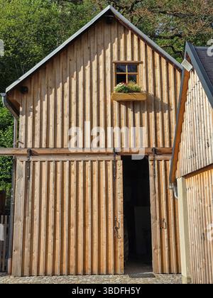 old wooden barn or garage with wooden board facade Stock Photo