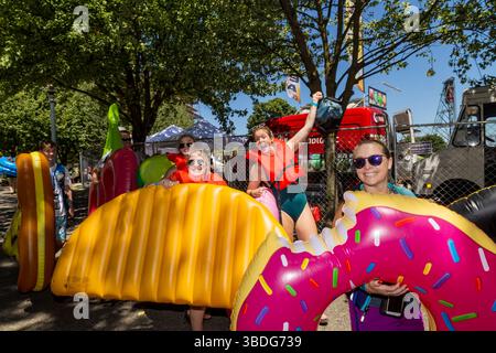 The Big Float, Portland, Oregon - July 14th 2018: People with inflatable toys and life vests participate in the annual Big Float event on the Willamet Stock Photo