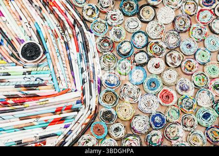Paper application. Pieces of paper rolled into a tube and glued to cardboard, in the form of a picture. Stock Photo
