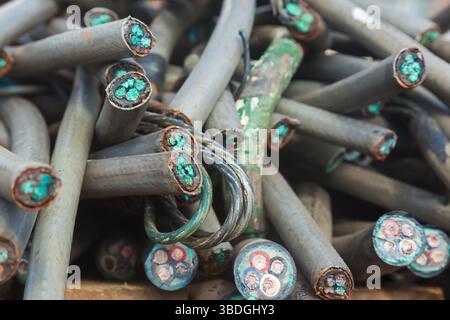 A bunch of old copper cables in a plastic sheath. Front view. Stock Photo