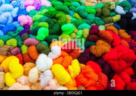 Yarn. Background from multi-colored threads for knitting closeup. Stock Photo