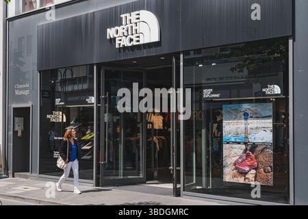 Urban storefront of The North Face brand showcasing adventure gear Stock Photo