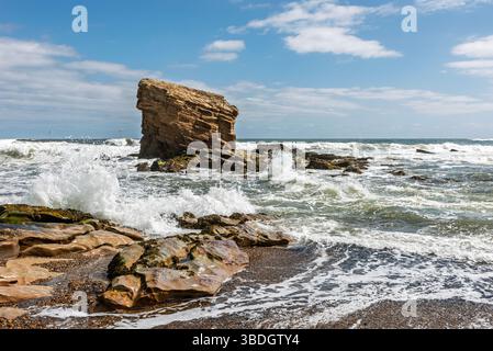 Crashing Waves: Sea Stack at Collywell Bay Stock Photo