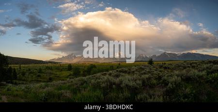 Large Cloud Formation Over The Grand Teton Range in early summer Stock Photo