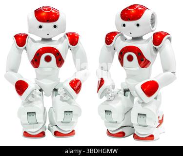 AI small red robot with human face and body isolated on white background. Humanoid. Artificial Intelligence. Stock Photo