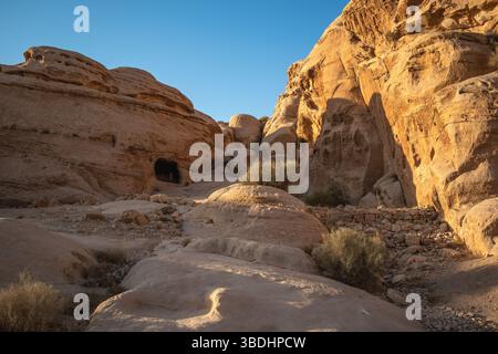 Rock Formation during Sunny Day in Petra. Beautiful Sandstone in Jordan. Middle East Stone Texture with Blue Sky. Stock Photo