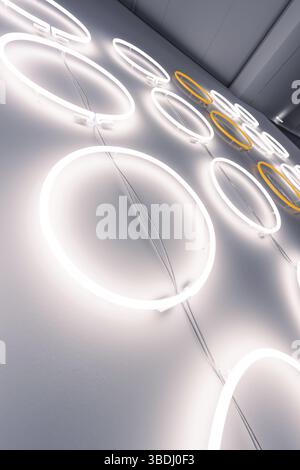 Neon lights in the shape of a circle on the wall create a modern, minimalist ambience, Schauwerk Sindelfingen, Germany, Europe Stock Photo