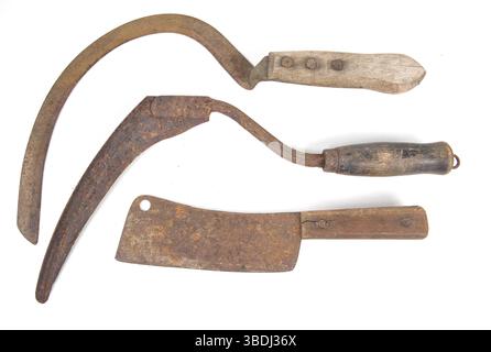 Old Amish farm tools isolated on white. Stock Photo