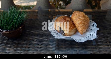 Pastries on plate on table Stock Photo