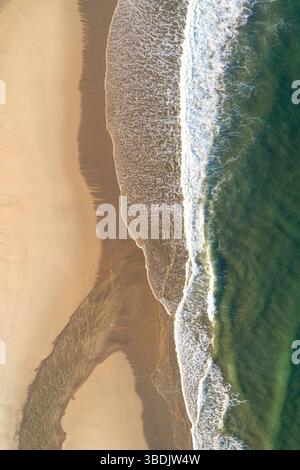 aerial view of natural sand patterns and textures by water Stock Photo