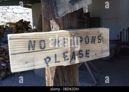 rusti wooden baord sign on a post with the warning Stock Photo