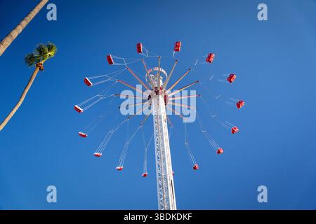 Empty Carnival ride spins in the sky Stock Photo
