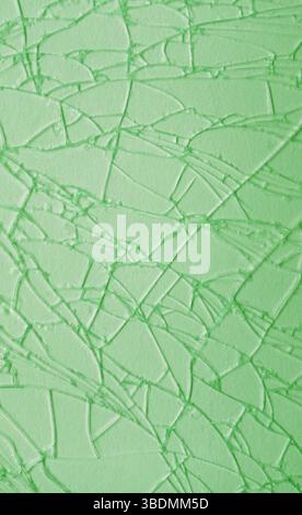 Artistic pattern of light green cracked glass surface Stock Photo