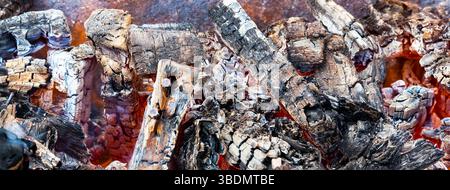 Close-up of smoldering wood and the heat from the coals. Stock Photo