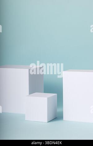 Showcase stands for online marketing. Minimal concept with white cubes on blue background. Stock Photo