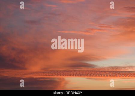Romantic. Incredibly beautiful sunset. Pink clouds. Universal horizontal picture. The background picture. Stock Photo