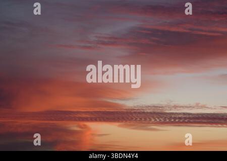 Pink clouds. Incredibly beautiful sunset. Universal horizontal picture. The background picture. Romantic. Stock Photo
