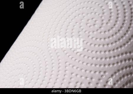 Texture of white paper towel on black background. Macro. Soft, delicate paper. Stock Photo