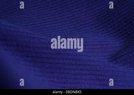Blue striped fabric is folded. Textiles. Banner for advertising goods for creativity. Polyester fabric background texture. Stock Photo