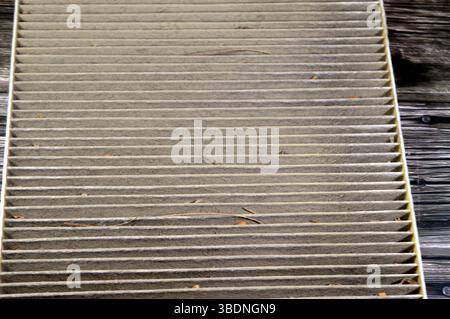 old dirty used car AC air conditioning filter full of dust removed from the vehicle to be replaced with a new one, cabin air carbon filter, rectangula Stock Photo