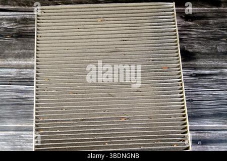 old dirty used car AC air conditioning filter full of dust removed from the vehicle to be replaced with a new one, cabin air carbon filter, rectangula Stock Photo