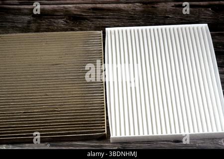 dirty old used car AC air conditioning filter full of dust removed from the vehicle to be replaced with a new one and a new cabin air carbon filter, r Stock Photo