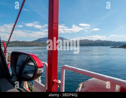 View from open car window whilst crossing Kyle Rhea from Kylerhea to Glenelg on the old Skye turntable ferry, Scotland, UK. Stock Photo