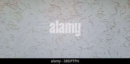 Decorative plaster creating a unique texture on a building exterior, adding visual interest and depth Stock Photo