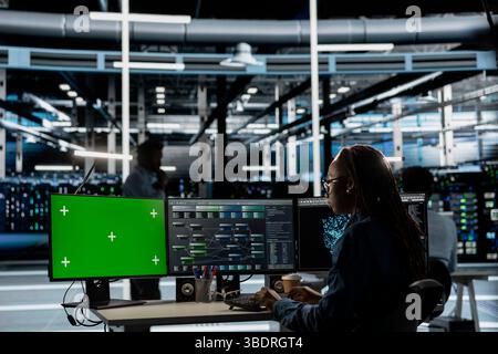 Server hub expert using AI programming language on chroma key computer to configure specialized hardware. Data center engineer using artificial intelligence neural networks on isolated screen PC Stock Photo