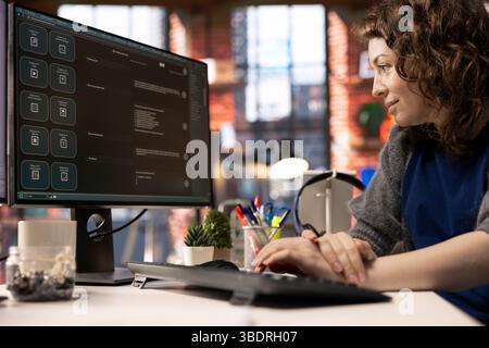 Worker uses AI chatbot system on a computer to guide her through problem solving tasks, futuristic technology highlights smart algorithms and machine learning. Communication and IT support. Stock Photo