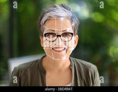 Modern facial recognition technology enhances identification in daily life Stock Photo