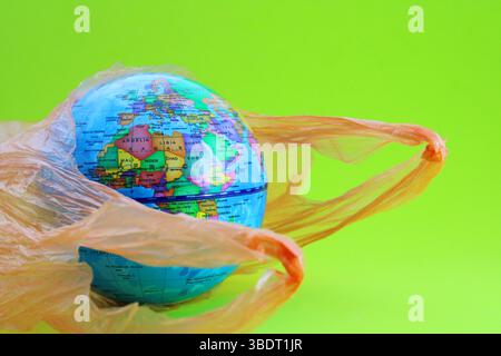 Planet emerging from a garbage bag, European, Asian and African continents Stock Photo