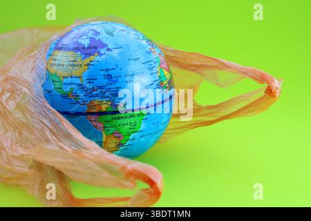 Planet emerging from a garbage bag, showing the American continent Stock Photo
