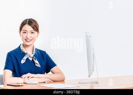 Female customer service representative smiling at the camera Stock Photo