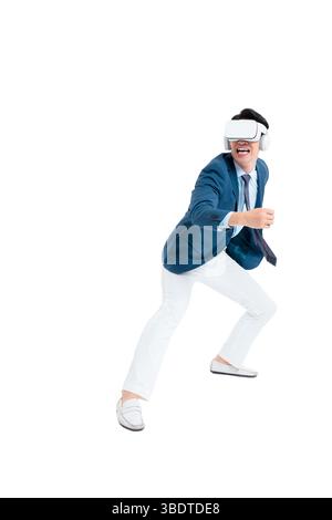 A suited businessman interacts with virtual objects through frenzied gestures, wearing VR/AR headset Stock Photo