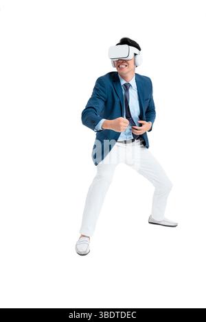 A suited businessman interacts with virtual objects through frenzied gestures, wearing VR/AR headset Stock Photo