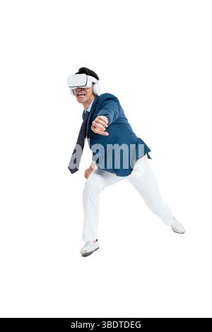 A suited businessman interacts with virtual objects through frenzied gestures, wearing VR/AR headset Stock Photo
