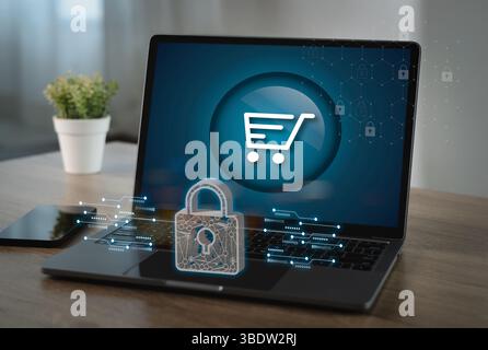 A digital payment security image shows laptop with shopping cart icon screen, surrounded by digital security symbols, indicating online shopping Stock Photo