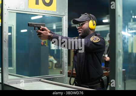 Tactical Rifle Officer A tactical officer wearing safety equipment, including helmet and body ...