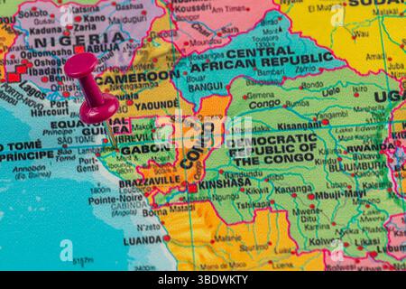 A pink pin marks a location on a detailed map of central Africa, illustrating countries such as Cameroon, Gabon, and the Democratic Republic of the Co Stock Photo