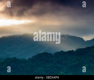 Sunrise and misty rainforests and mountains seen from the island Bahia ...